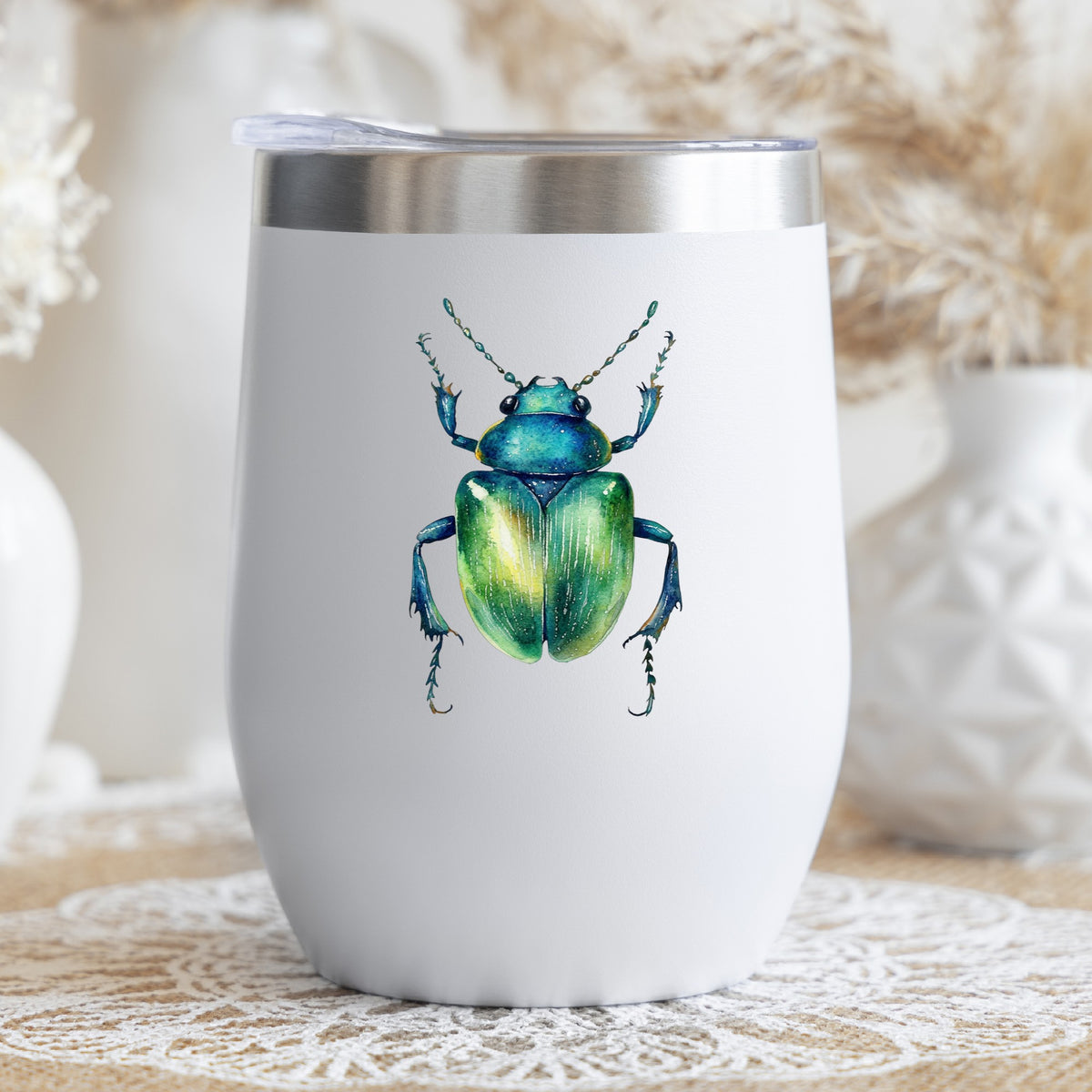 Emerald Green Beetle UV DTF sticker applied to a white stemless tumbler with a lid