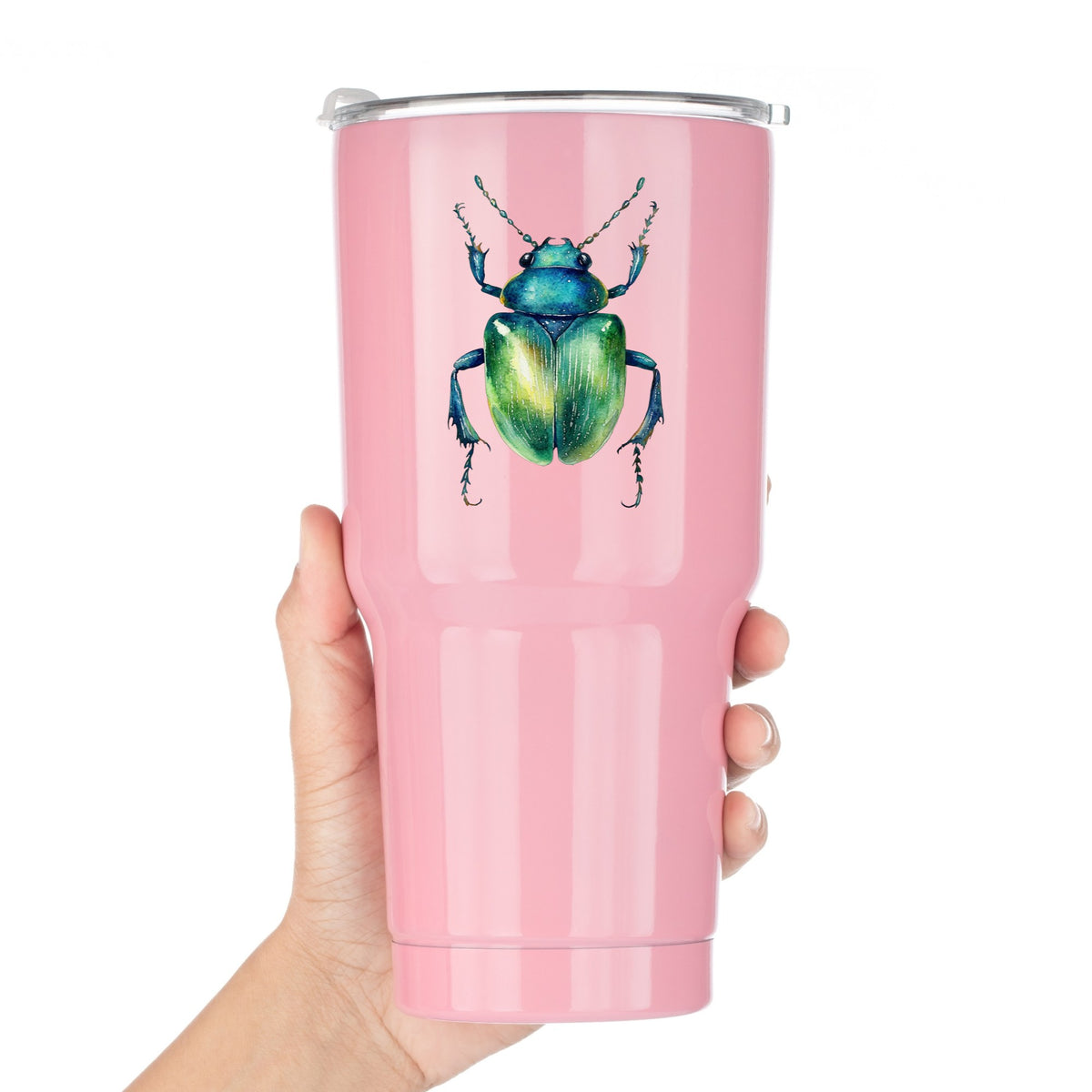 Emerald Green Beetle UV DTF sticker applied to a pink tumbler held against a white background
