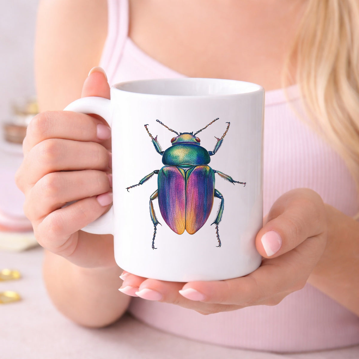 Rainbow Iridescent Beetle UV DTF sticker applied to a white coffee mug held in both hands