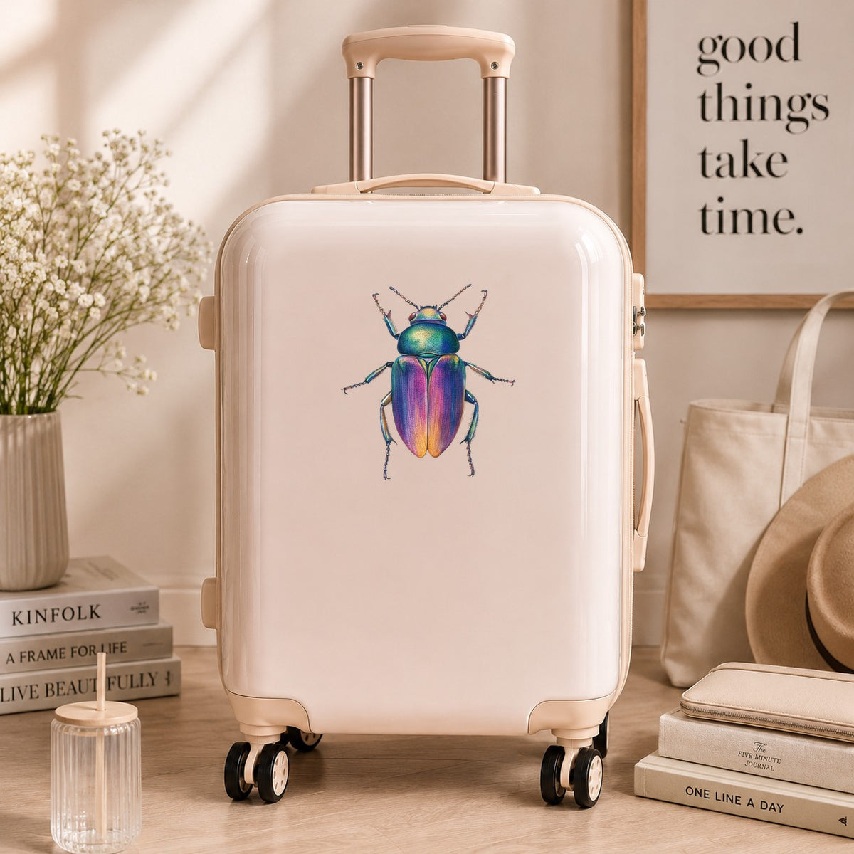 Rainbow Iridescent Beetle UV DTF sticker applied to a cream carry-on suitcase