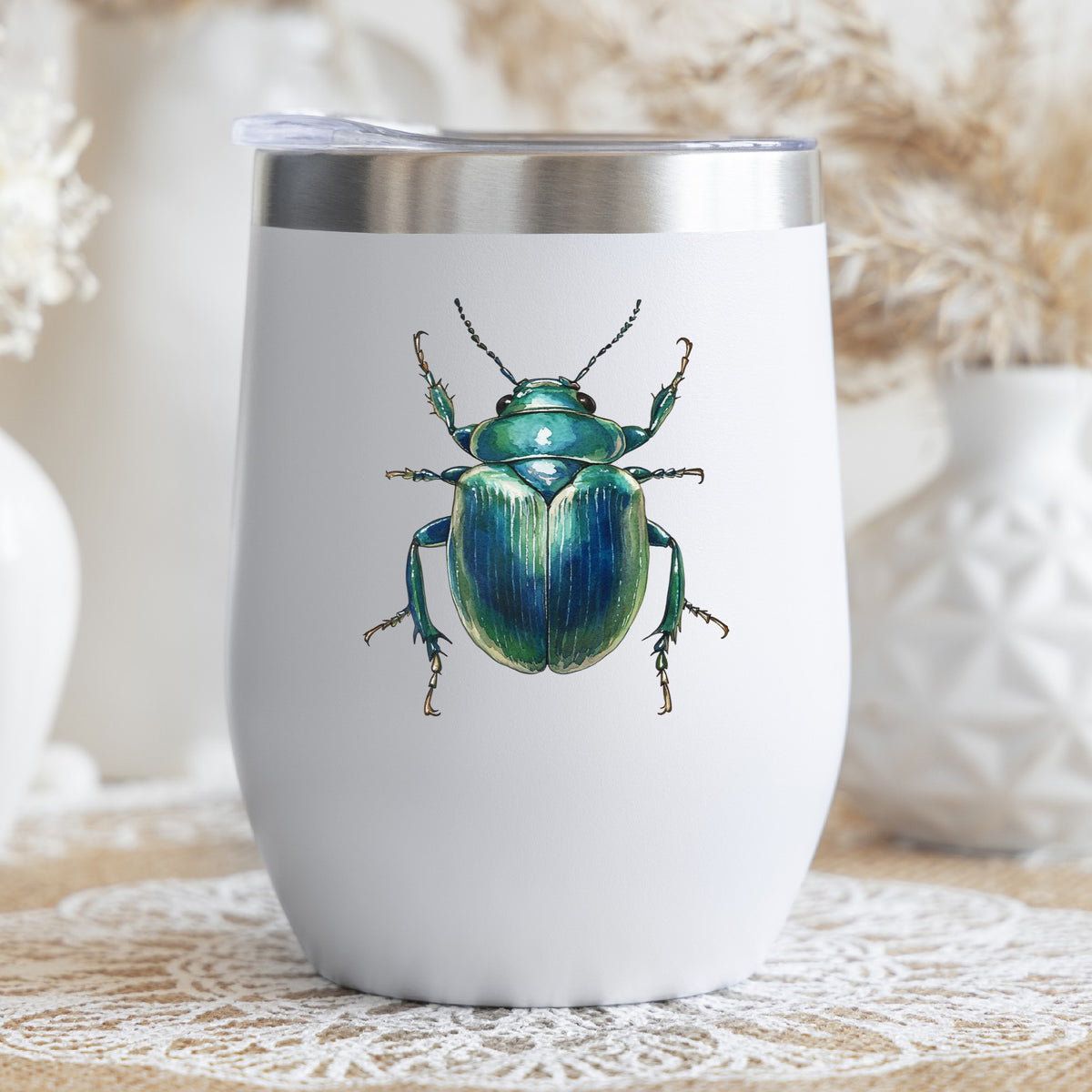 Striped Teal Beetle UV DTF sticker applied to a white stemless tumbler with a lid