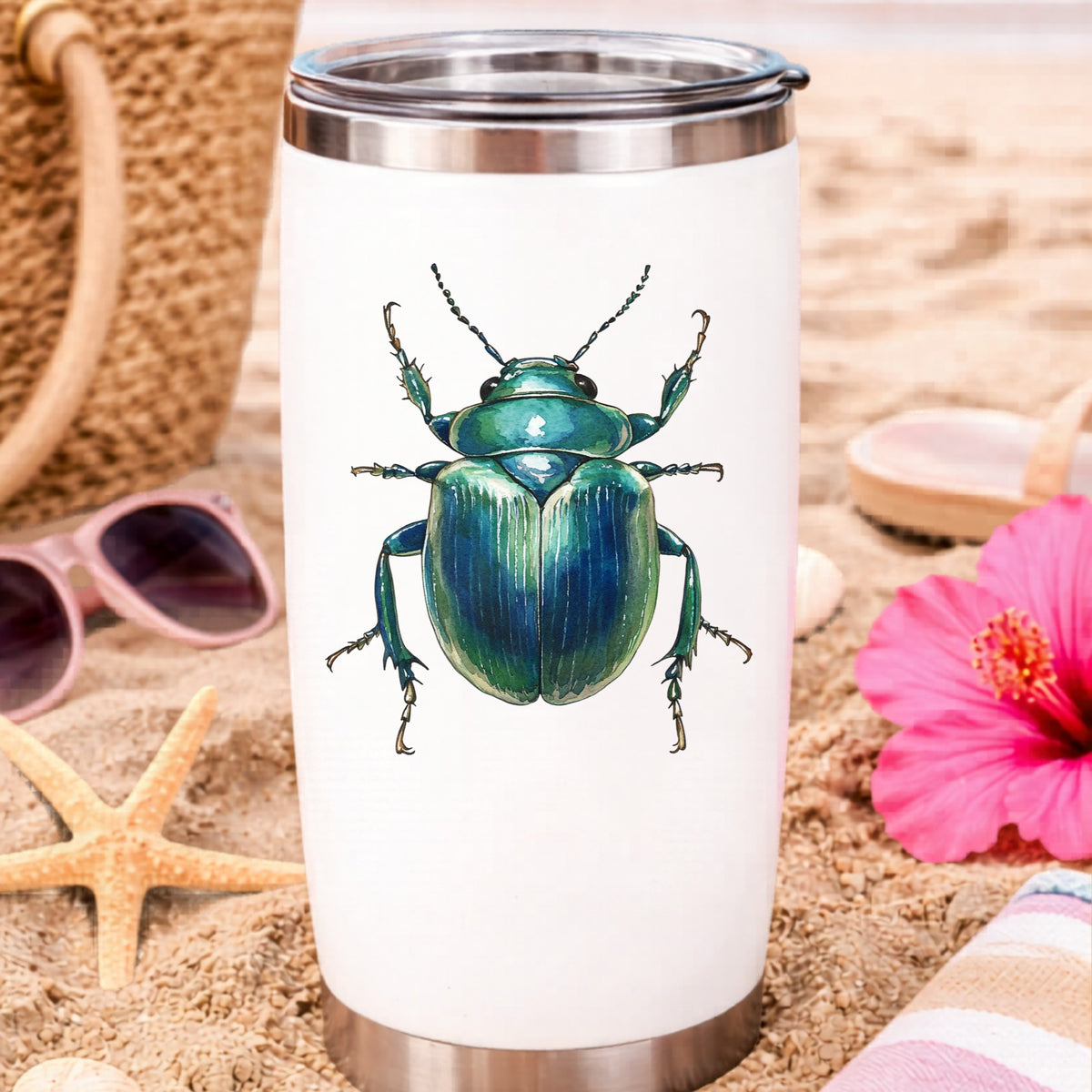 Striped Teal Beetle UV DTF sticker applied to a white travel tumbler on beach sand