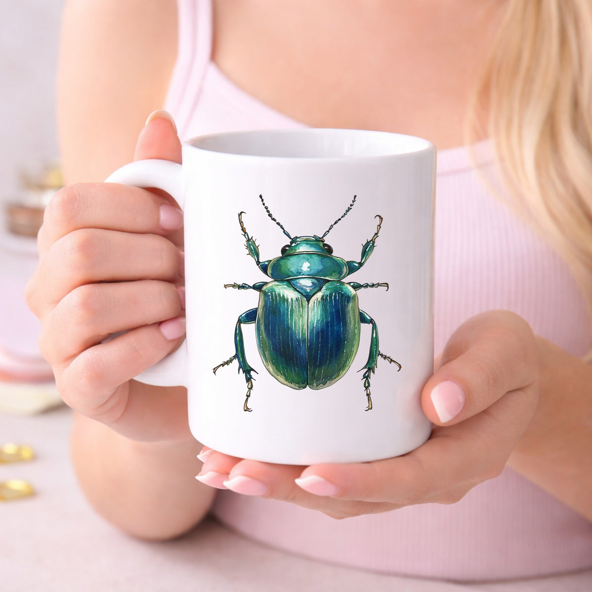 Striped Teal Beetle UV DTF sticker applied to a white coffee mug held in both hands