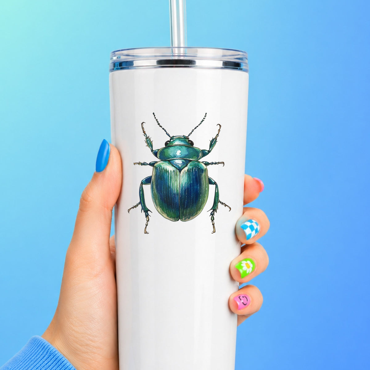 Striped Teal Beetle UV DTF sticker applied to a white straw tumbler on a blue background