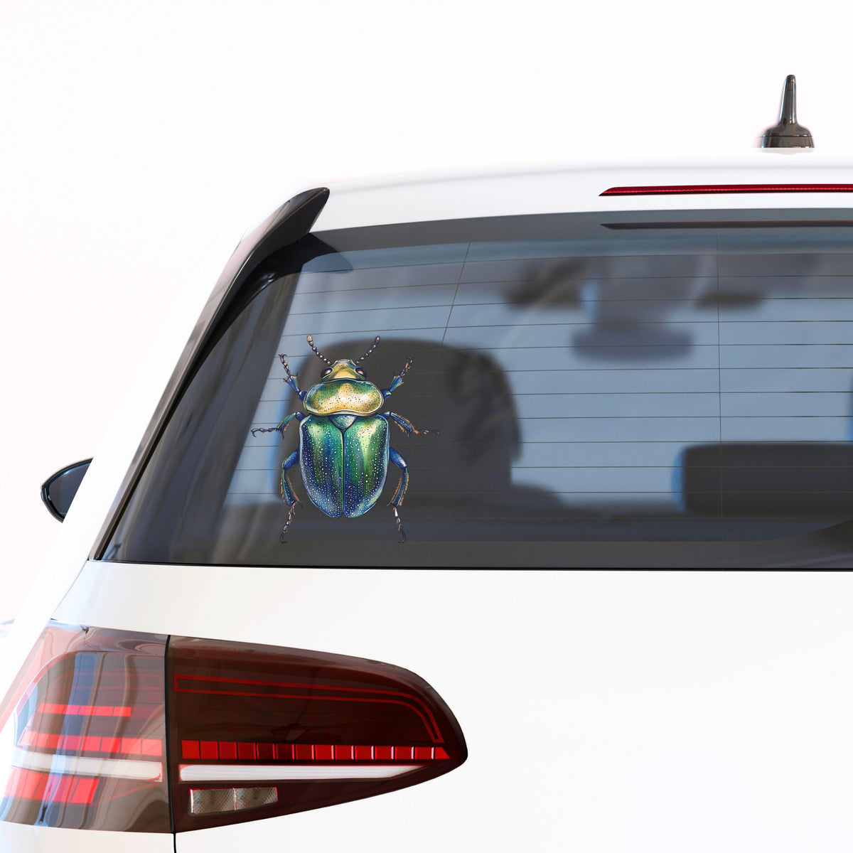 Speckled Green Beetle UV DTF sticker applied to the rear window of a white car