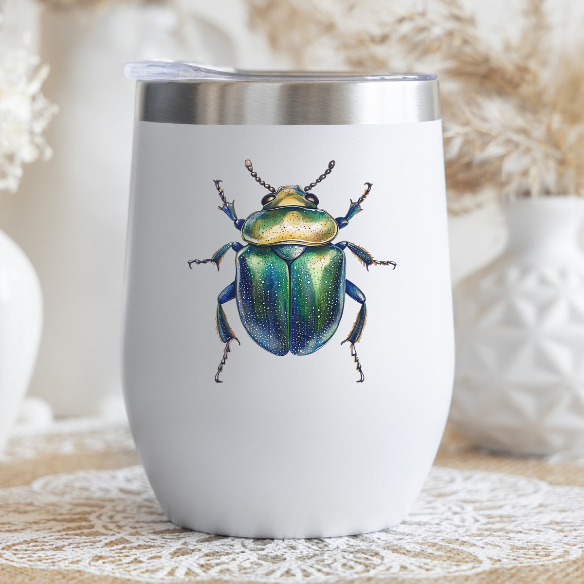 Speckled Green Beetle UV DTF sticker applied to a white stemless tumbler with a lid