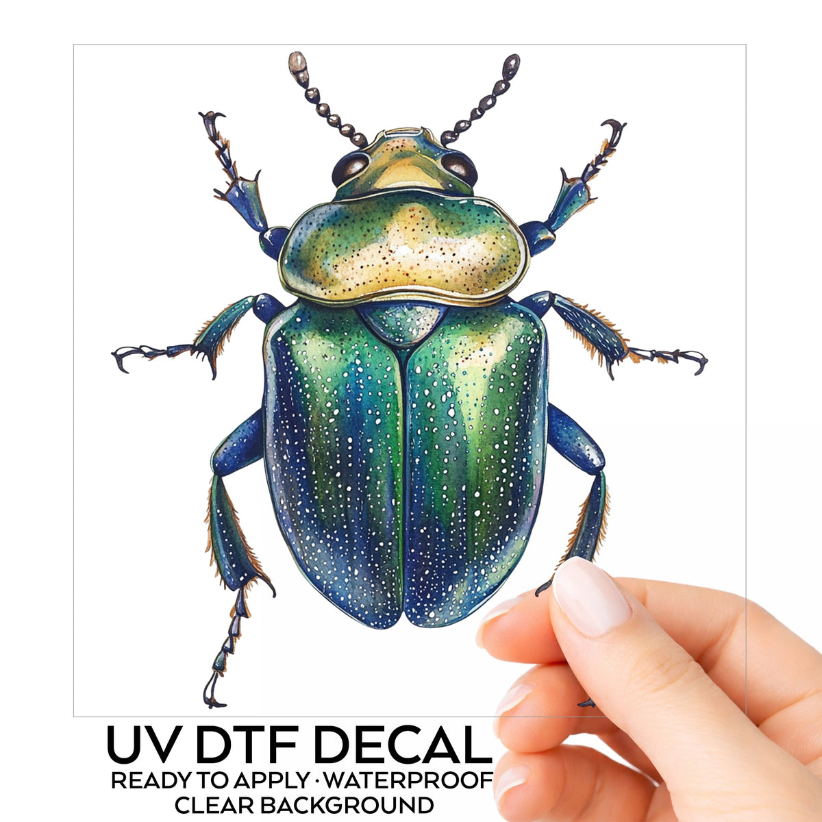 Speckled Green Beetle UV DTF sticker on its backing card, held in hand