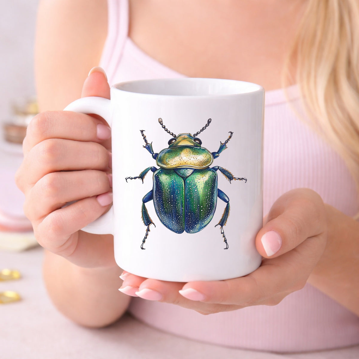 Speckled Green Beetle UV DTF sticker applied to a white coffee mug held in both hands
