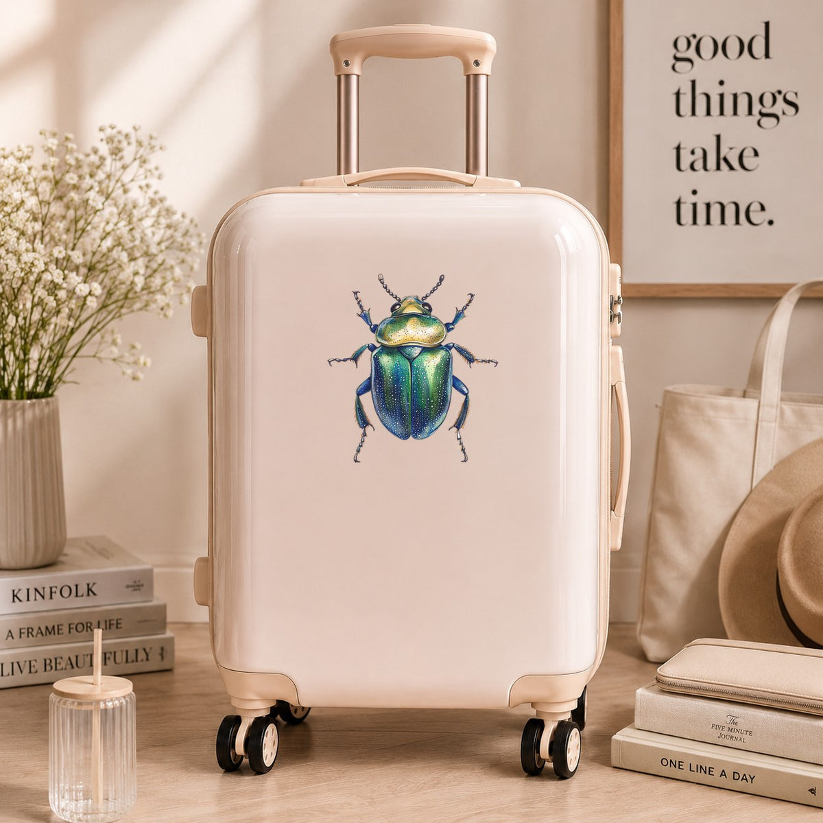 Speckled Green Beetle UV DTF sticker applied to a cream carry-on suitcase