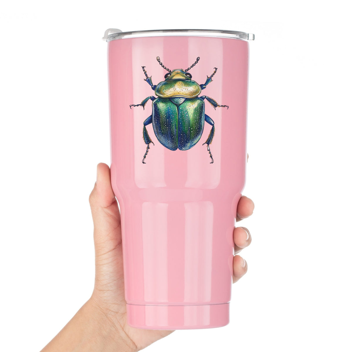 Speckled Green Beetle UV DTF sticker applied to a pink tumbler held against a white background