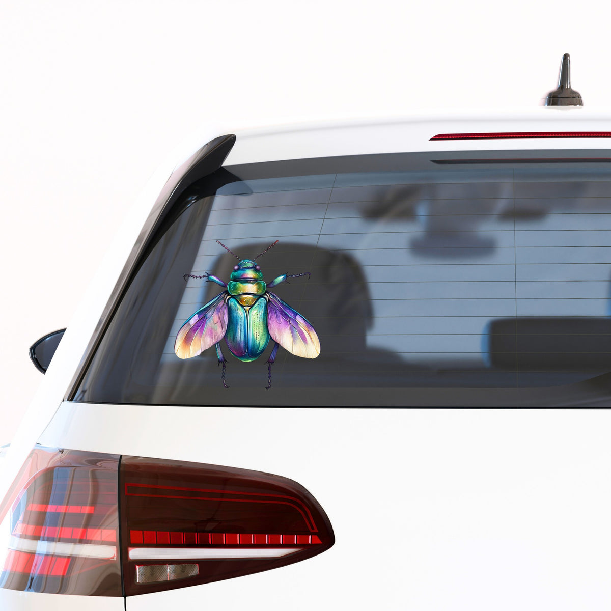 Flying Beetle With Open Wings UV DTF sticker applied to the rear window of a white car