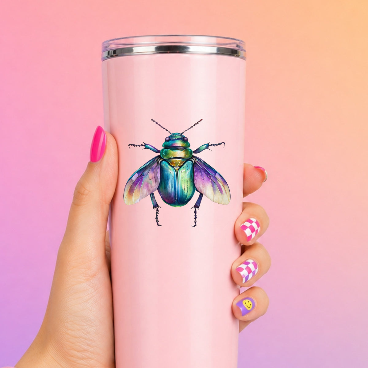 Flying Beetle With Open Wings UV DTF sticker applied to a tall pink tumbler on a pink and orange background
