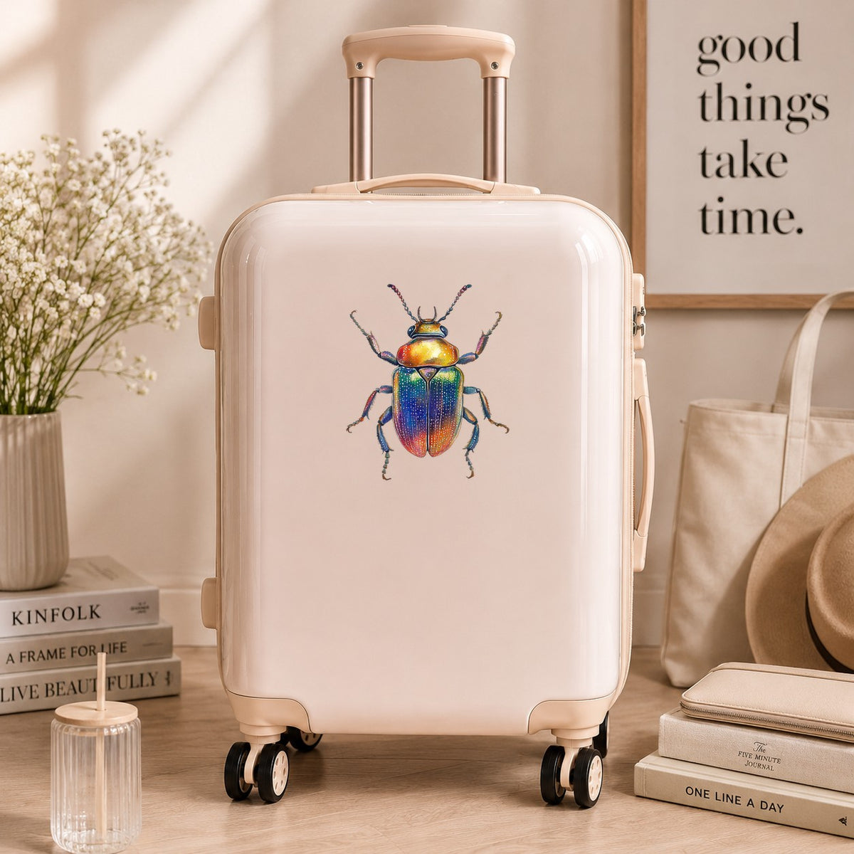 Horned Rainbow Beetle UV DTF sticker applied to a cream carry-on suitcase