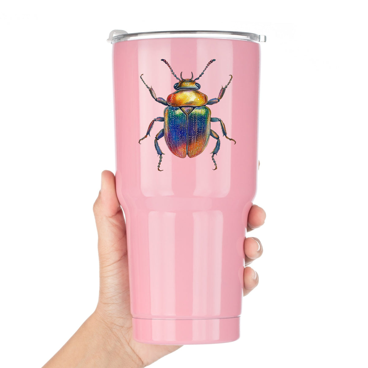Horned Rainbow Beetle UV DTF sticker applied to a pink tumbler held against a white background