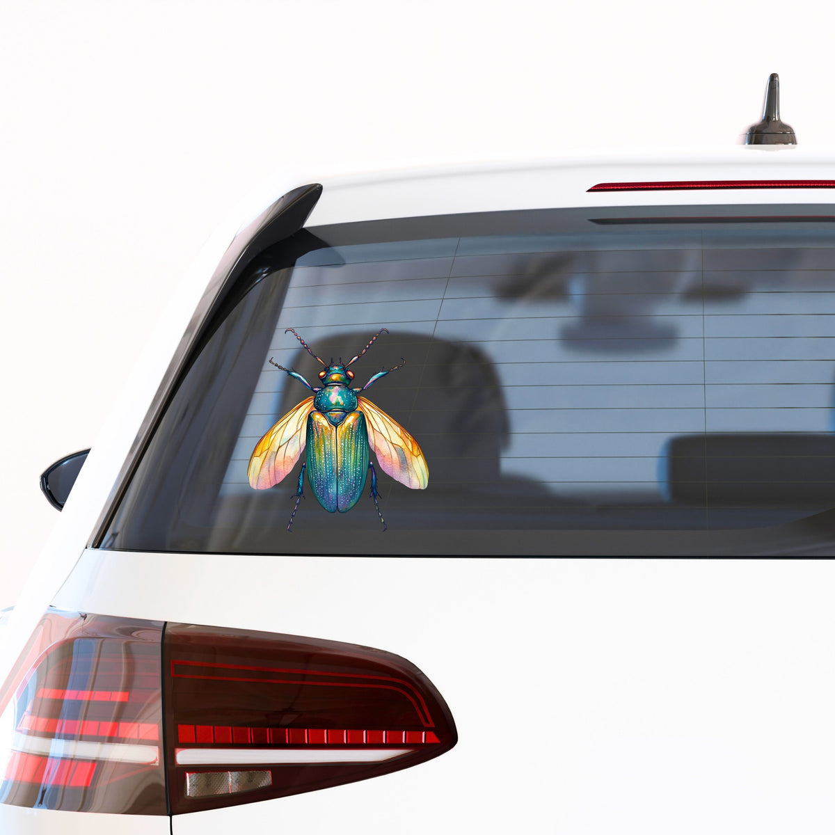 Golden Winged Flying Beetle UV DTF sticker applied to the rear window of a white car