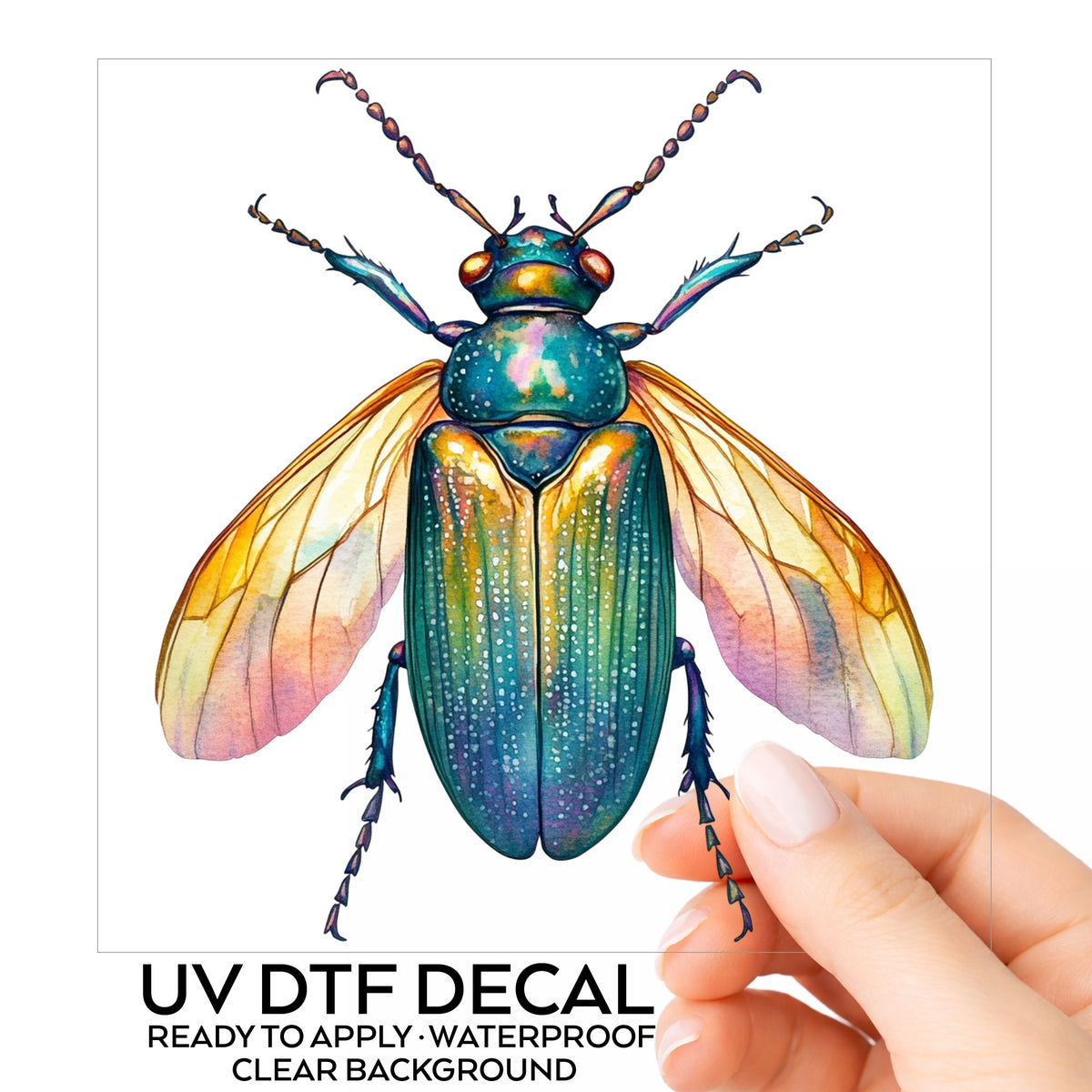 Golden Winged Flying Beetle UV DTF sticker on its backing card, held in hand