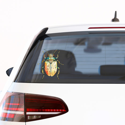 Cream And Coral Jeweled Beetle UV DTF sticker applied to the rear window of a white car