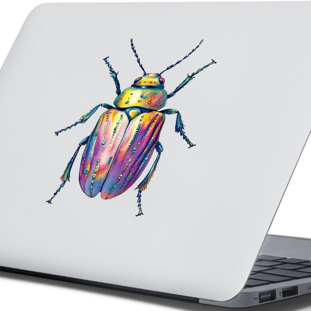 Purple Dewdrop Beetle UV DTF sticker applied to the lid of a silver laptop