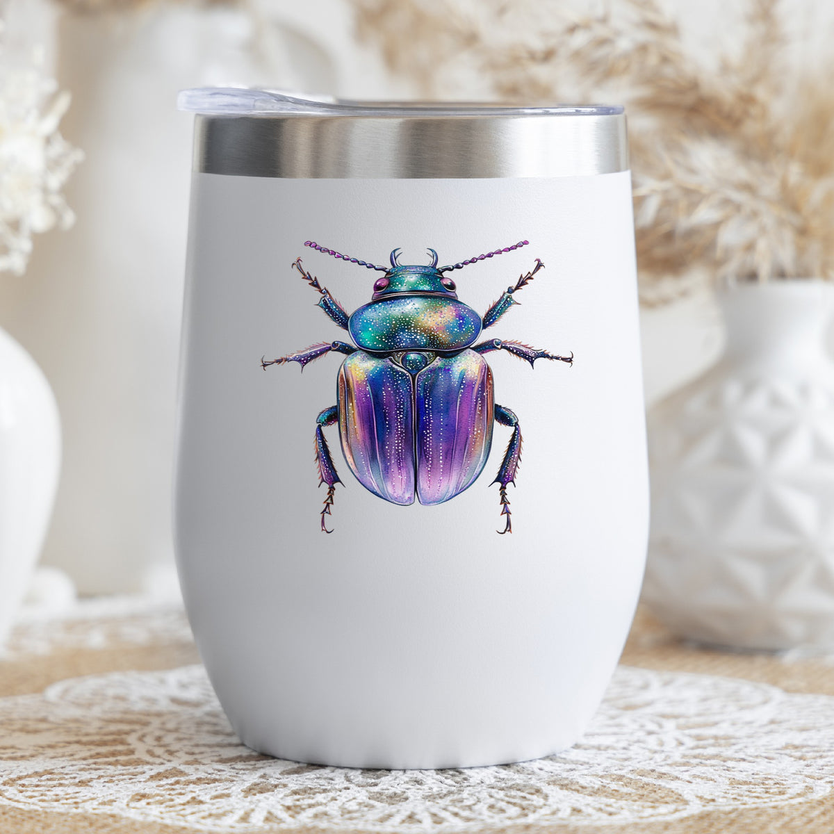 Violet Sparkle Beetle UV DTF sticker applied to a white stemless tumbler with a lid