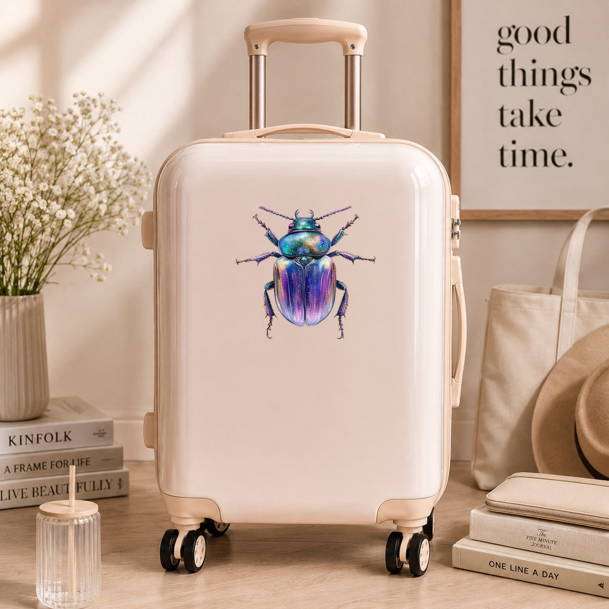 Violet Sparkle Beetle UV DTF sticker applied to a cream carry-on suitcase