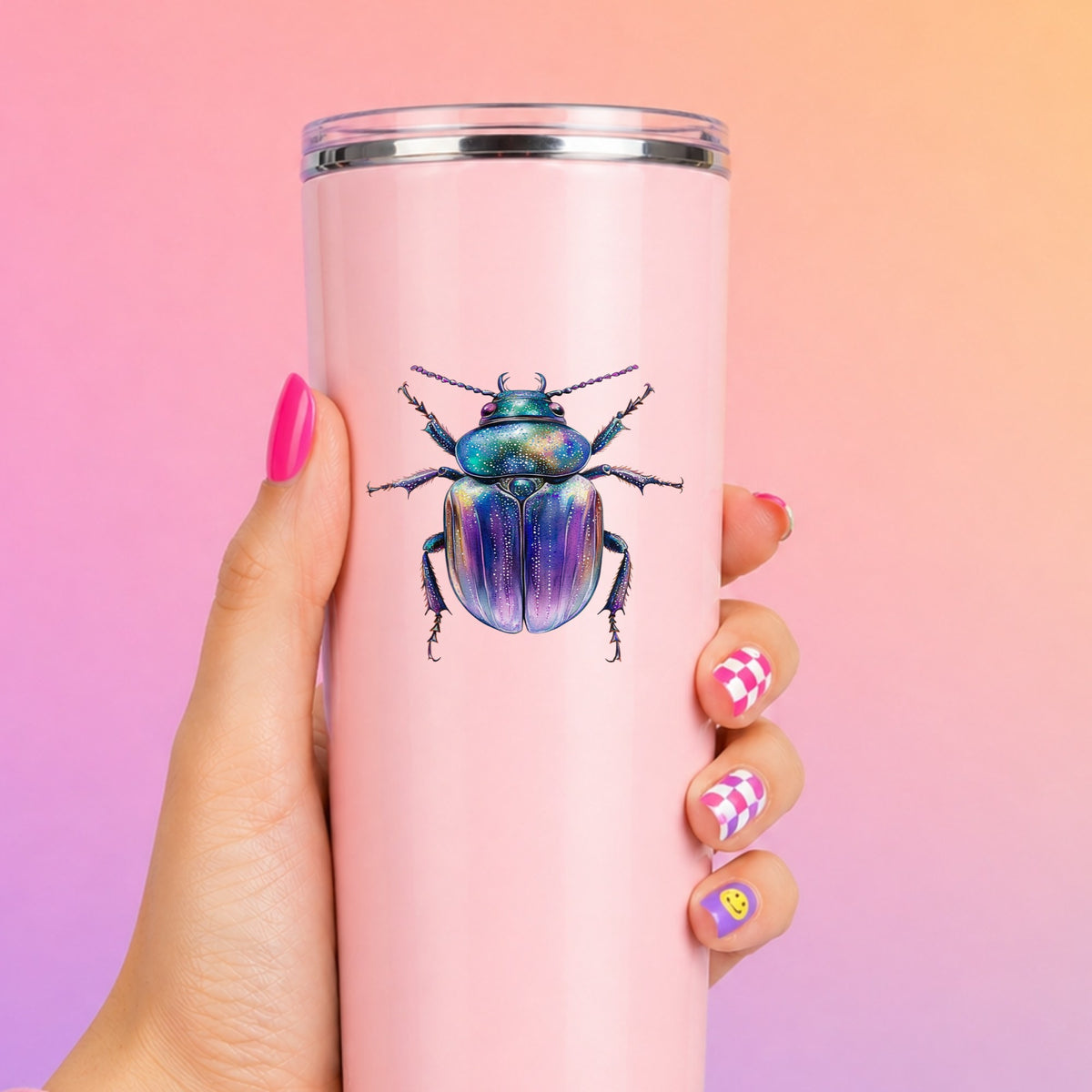 Violet Sparkle Beetle UV DTF sticker applied to a tall pink tumbler on a pink and orange background