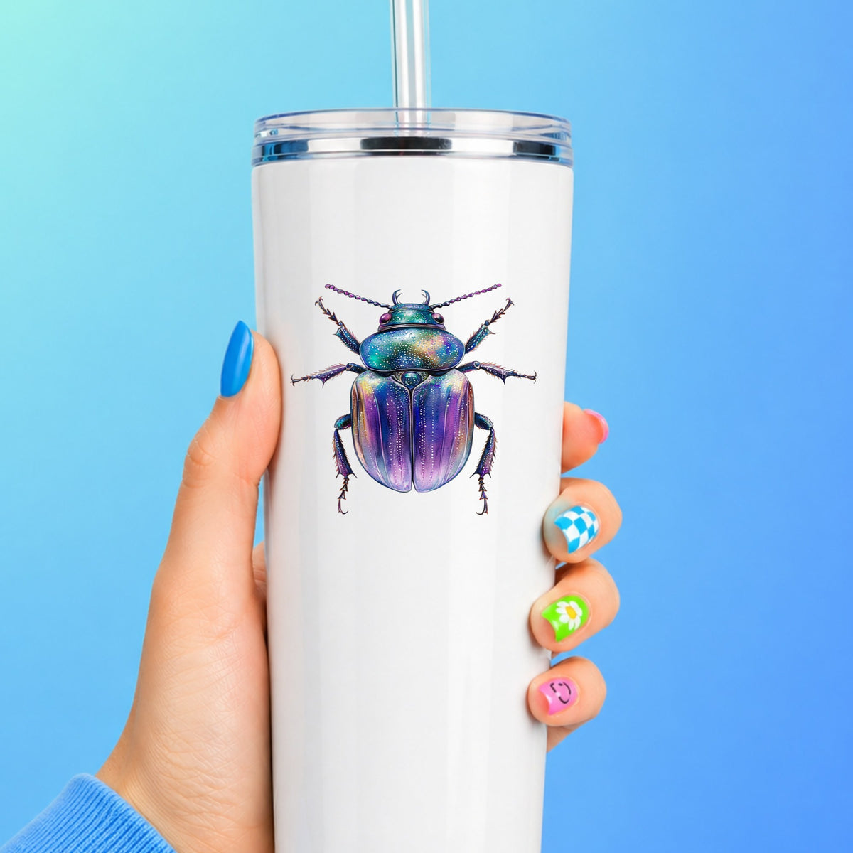 Violet Sparkle Beetle UV DTF sticker applied to a white straw tumbler on a blue background
