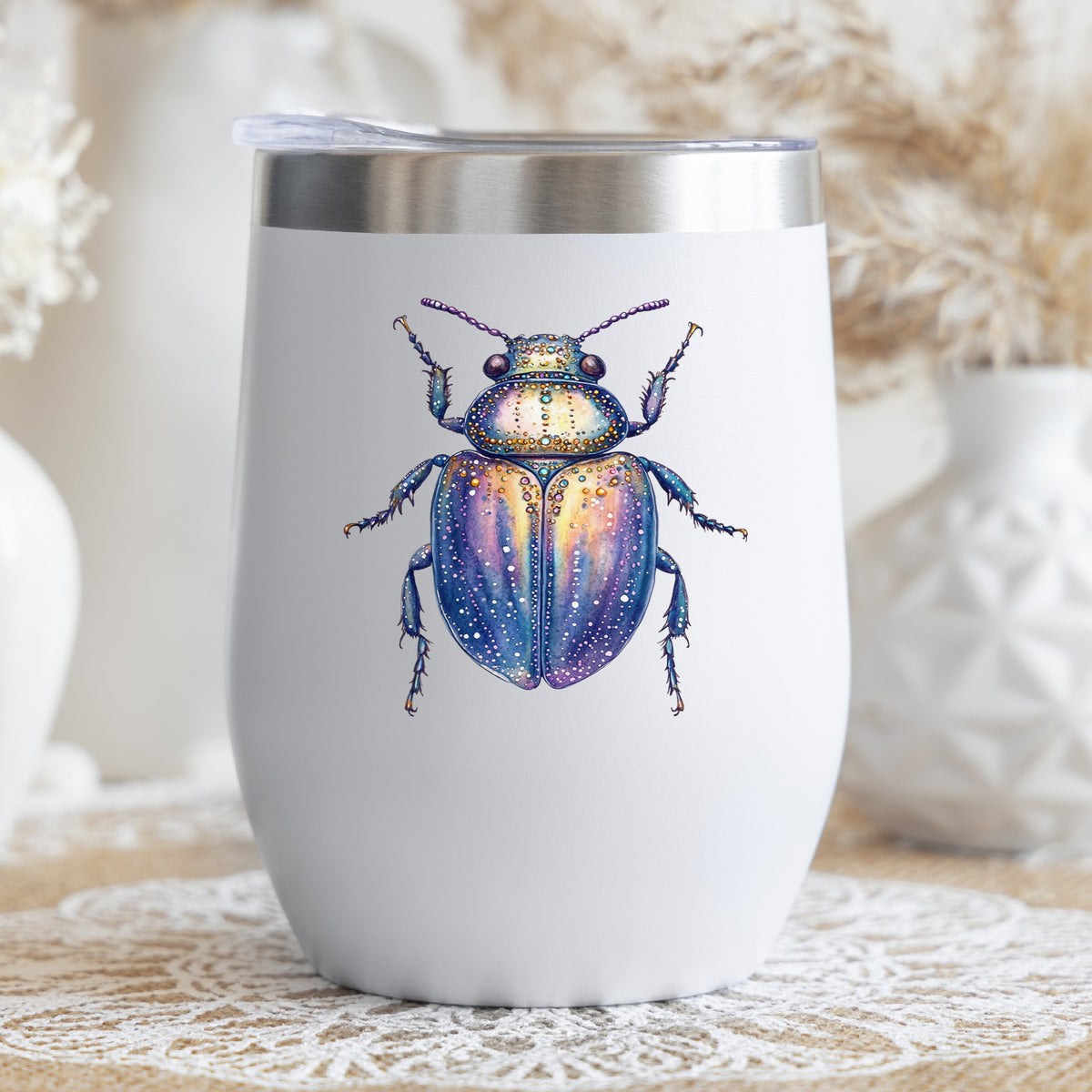 Lavender Jeweled Beetle UV DTF sticker applied to a white stemless tumbler with a lid