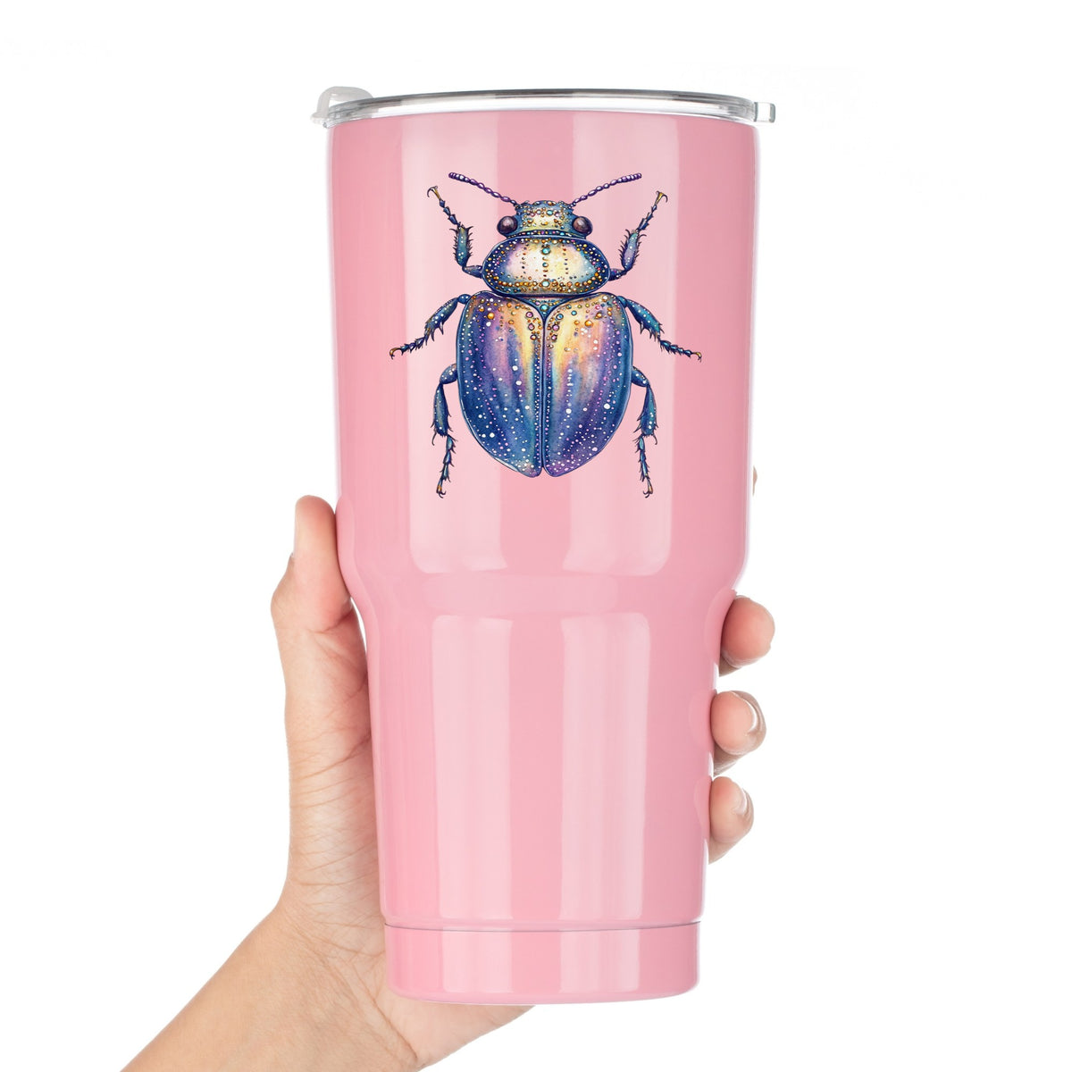 Lavender Jeweled Beetle UV DTF sticker applied to a pink tumbler held against a white background