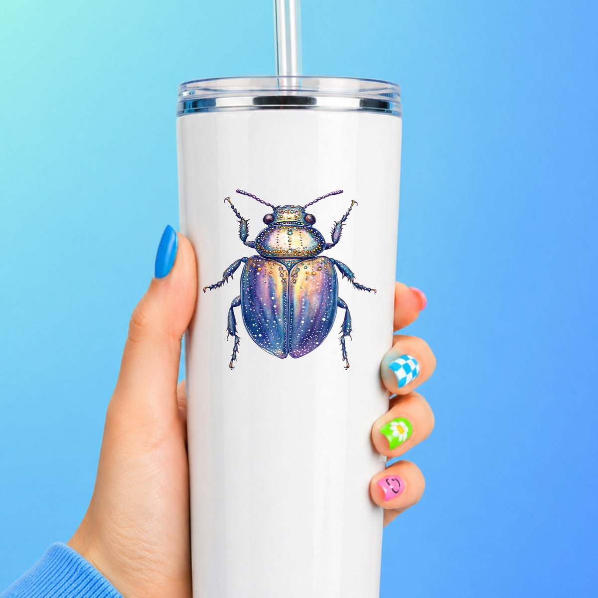 Lavender Jeweled Beetle UV DTF sticker applied to a white straw tumbler on a blue background