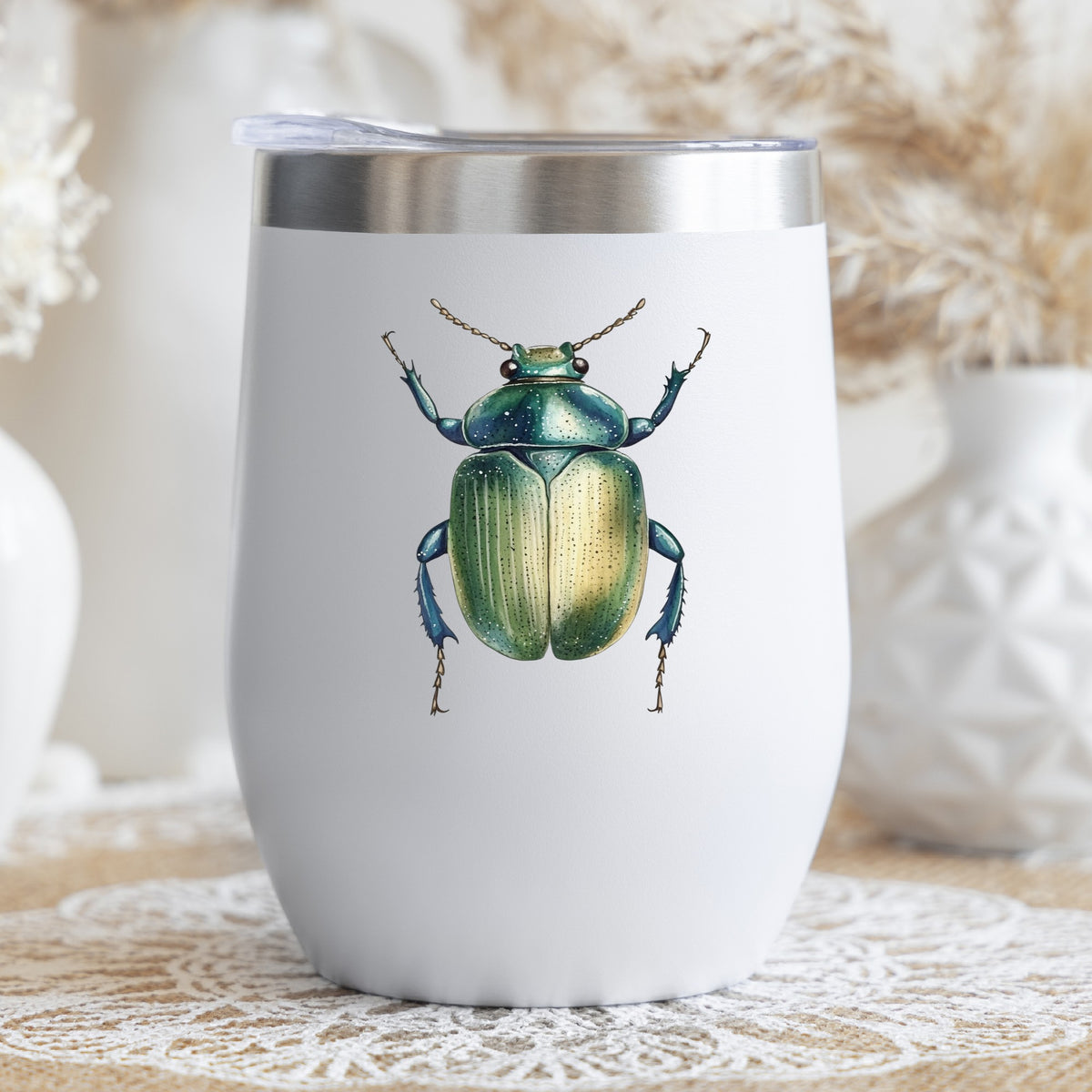 Green Scarab Beetle UV DTF sticker applied to a white stemless tumbler with a lid