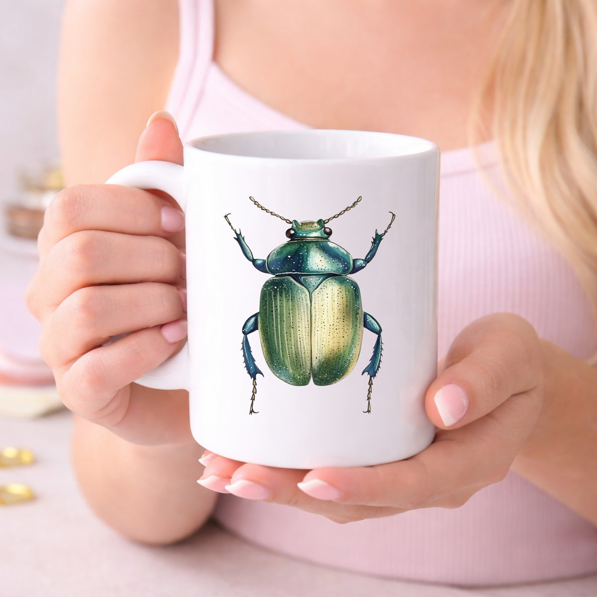 Green Scarab Beetle UV DTF sticker applied to a white coffee mug held in both hands