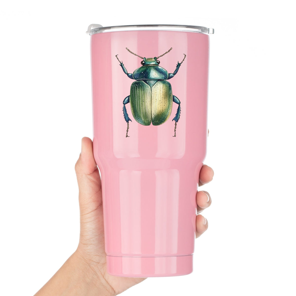 Green Scarab Beetle UV DTF sticker applied to a pink tumbler held against a white background
