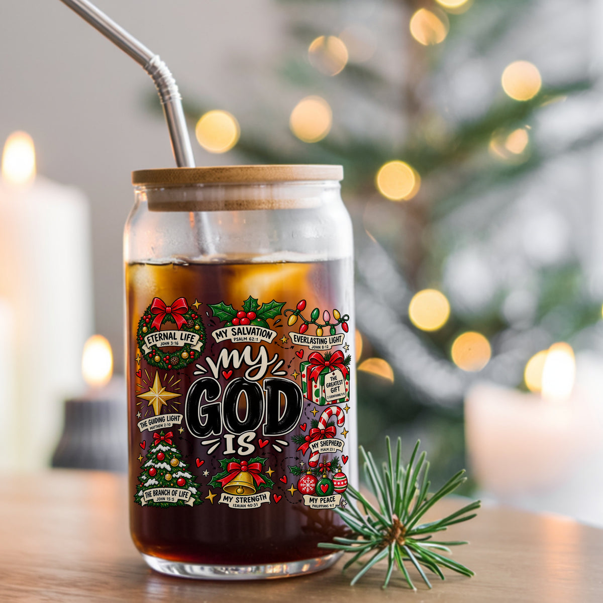 My God Is Christmas Scripture UV DTF sticker applied to a glass can cup of iced coffee with a straw
