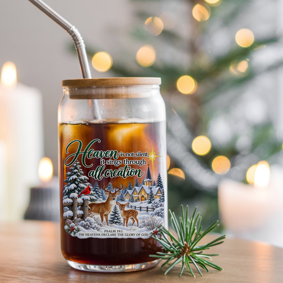 Heaven Is Not Silent Christmas Deer UV DTF sticker applied to a glass can cup of iced coffee with a straw