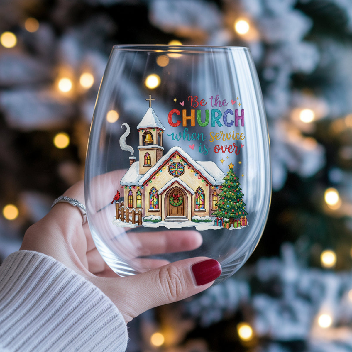 Be The Church Christmas Quote UV DTF sticker applied to a stemless wine glass held in hand