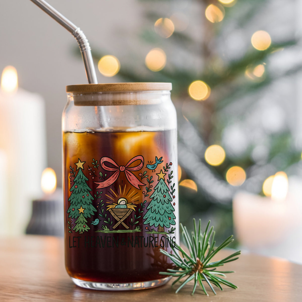 Let Heaven And Nature Sing Nativity UV DTF sticker applied to a glass can cup of iced coffee with a straw