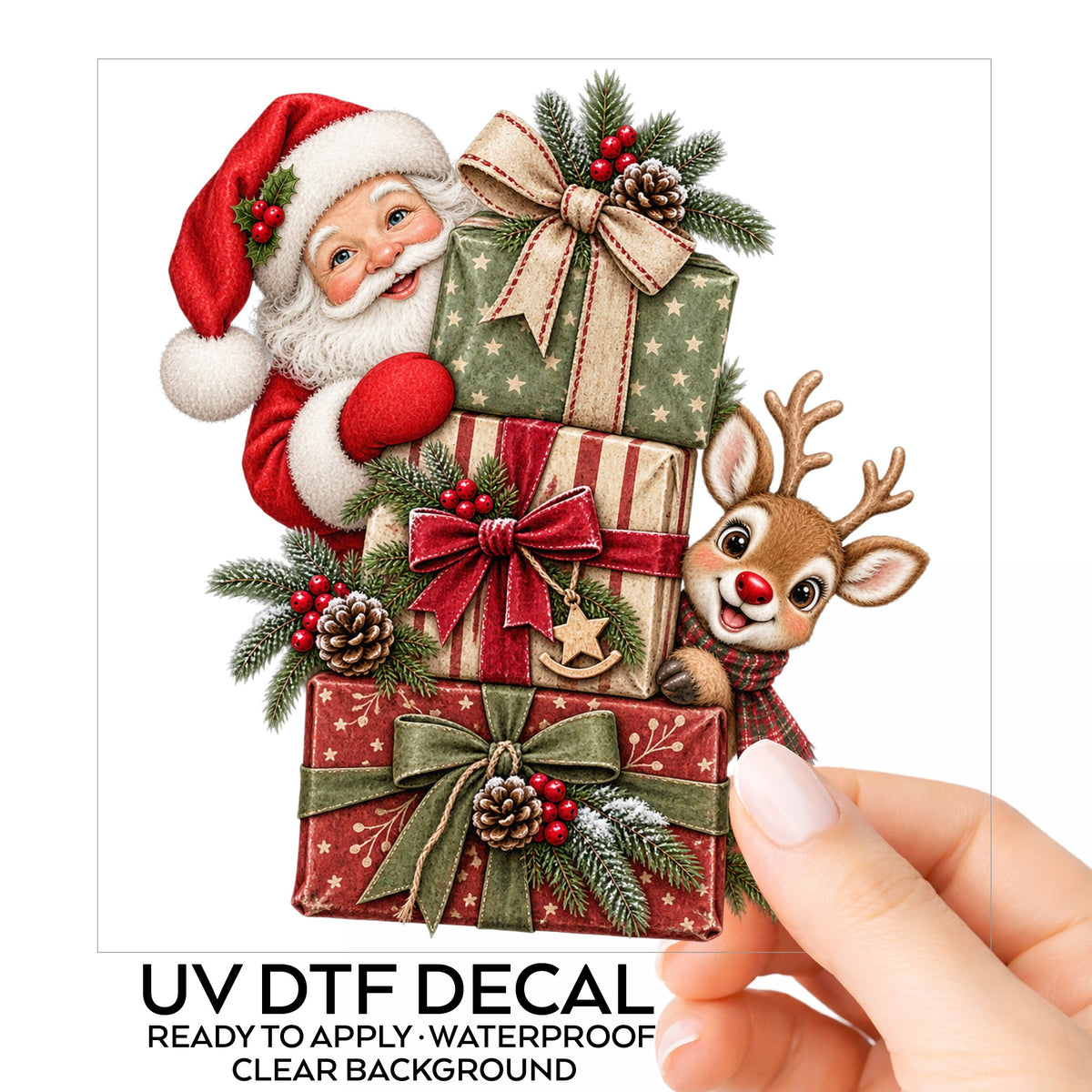 Santa And Reindeer With Stacked Gifts UV DTF sticker on its backing card, held in hand