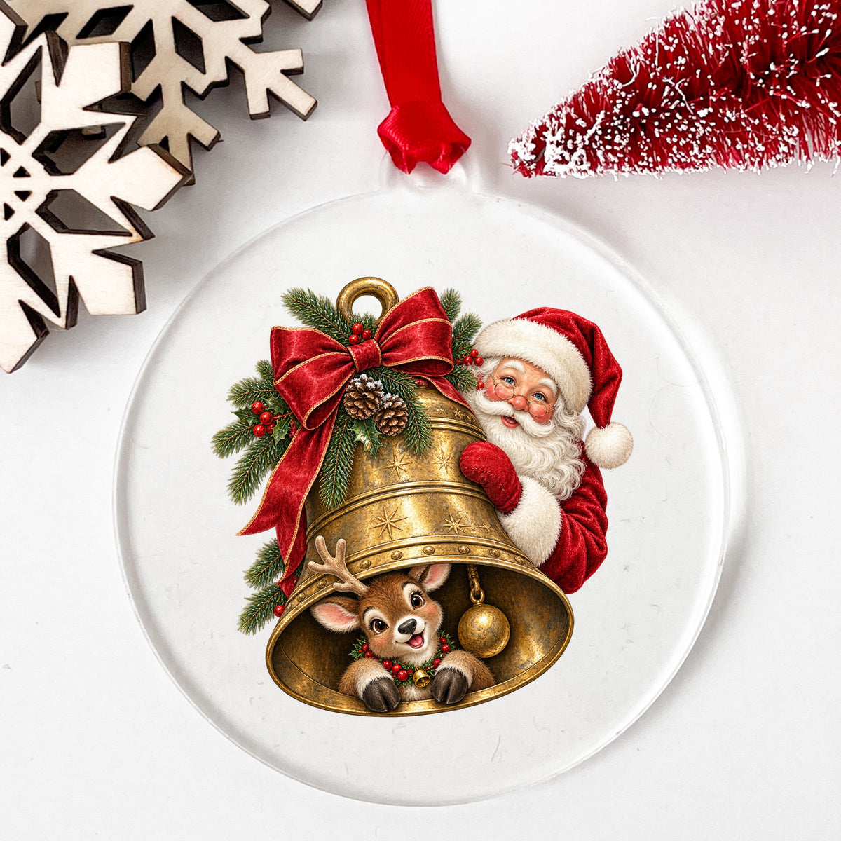 Santa And Reindeer With Gold Bell UV DTF sticker applied to a clear round acrylic ornament with a red ribbon