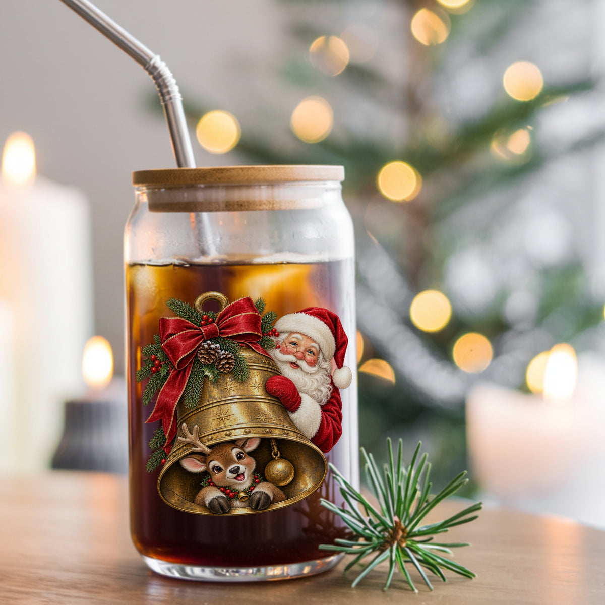 Santa And Reindeer With Gold Bell UV DTF sticker applied to a glass can cup of iced coffee with a straw