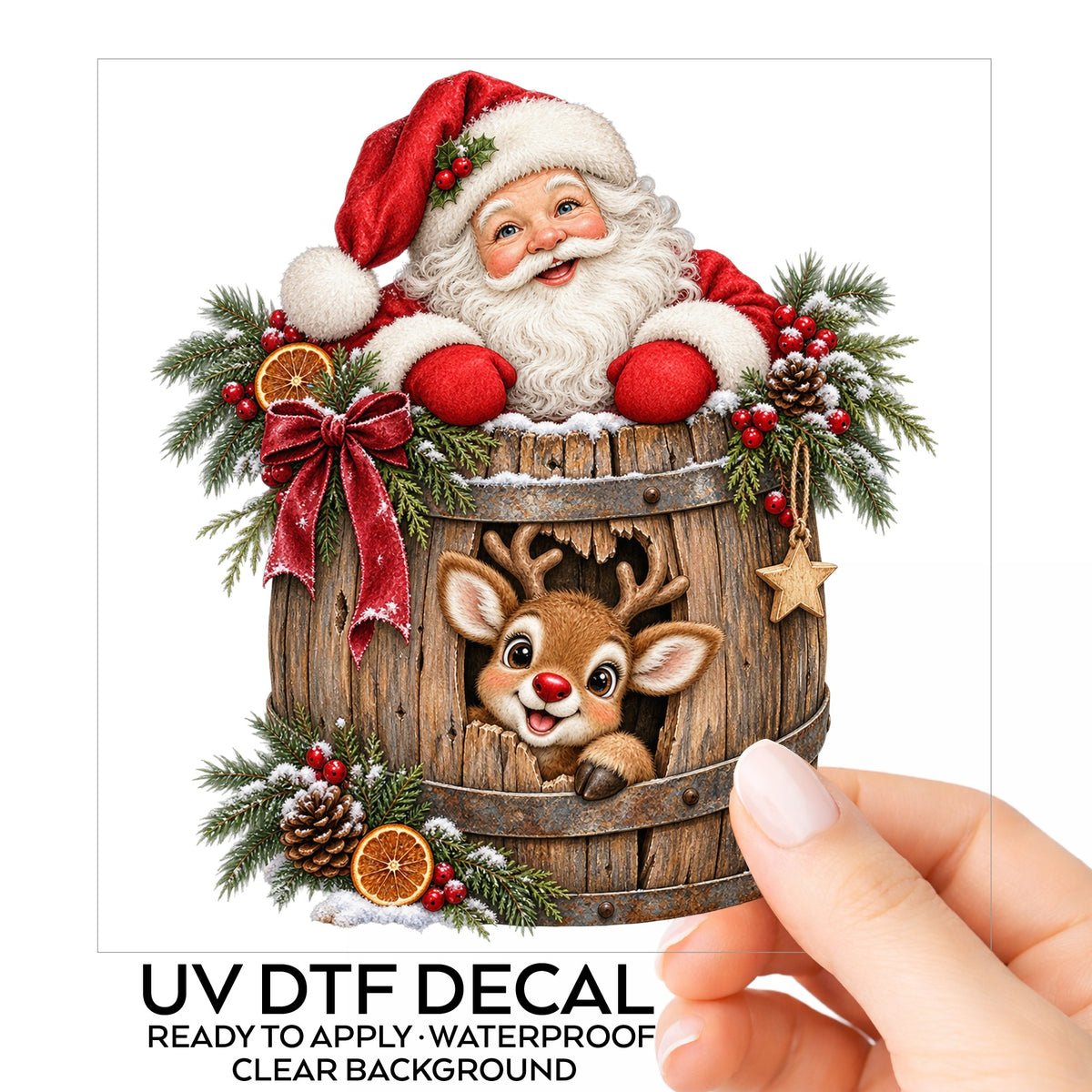 Santa And Reindeer In Wooden Barrel UV DTF sticker on its backing card, held in hand