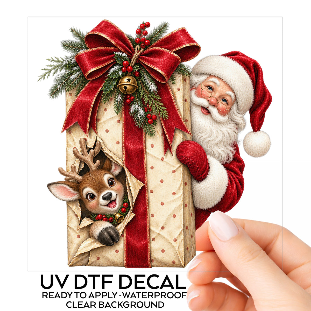 Santa Behind Polka Dot Gift With Reindeer UV DTF sticker on its backing card, held in hand