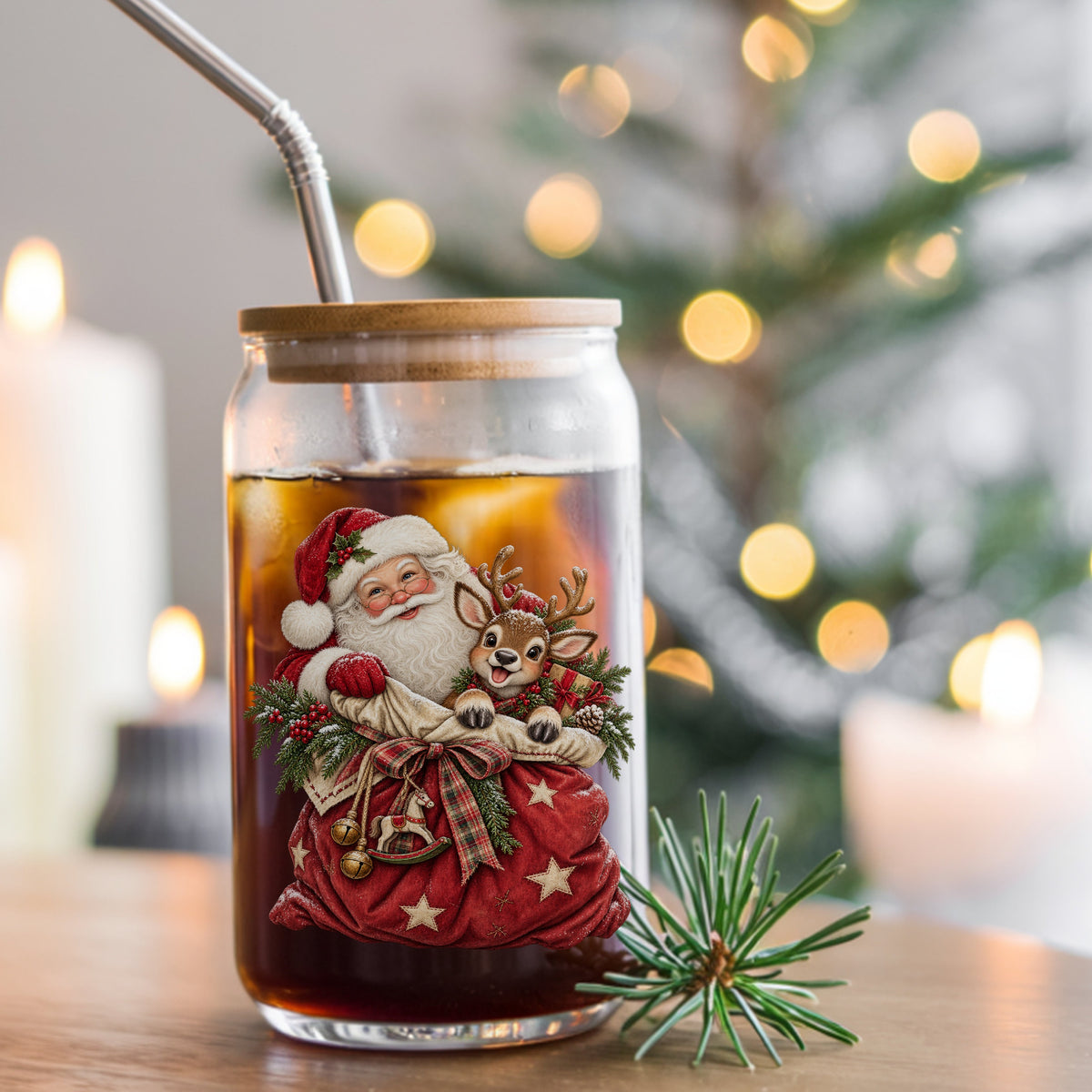 Santa With Red Toy Sack And Reindeer UV DTF sticker applied to a glass can cup of iced coffee with a straw