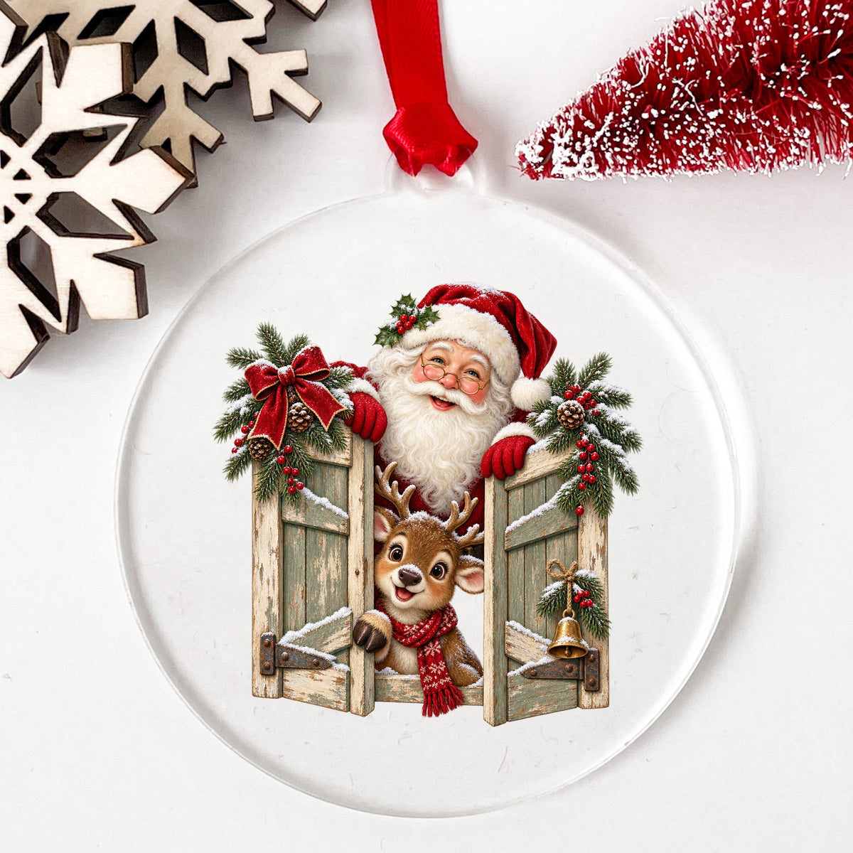 Santa And Reindeer Behind Wooden Shutters UV DTF sticker applied to a clear round acrylic ornament with a red ribbon
