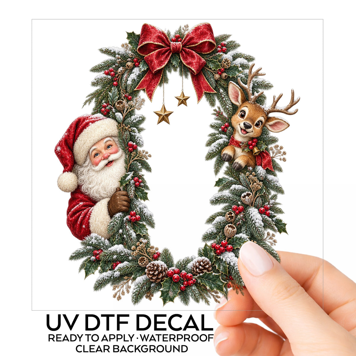 Santa And Reindeer Peeking Through Christmas Wreath UV DTF sticker on its backing card, held in hand