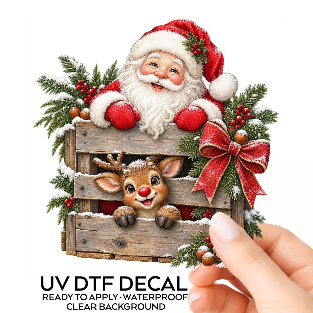 Santa And Reindeer With Wooden Crate UV DTF sticker on its backing card, held in hand