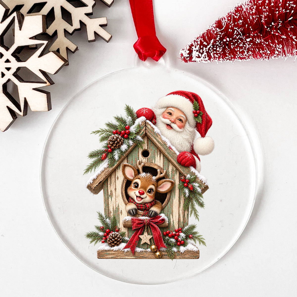 Santa And Reindeer With Rustic Birdhouse UV DTF sticker applied to a clear round acrylic ornament with a red ribbon