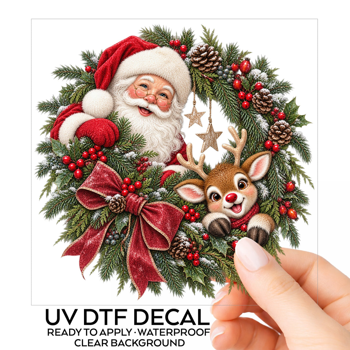 Santa And Reindeer In Berry Pinecone Wreath UV DTF sticker on its backing card, held in hand