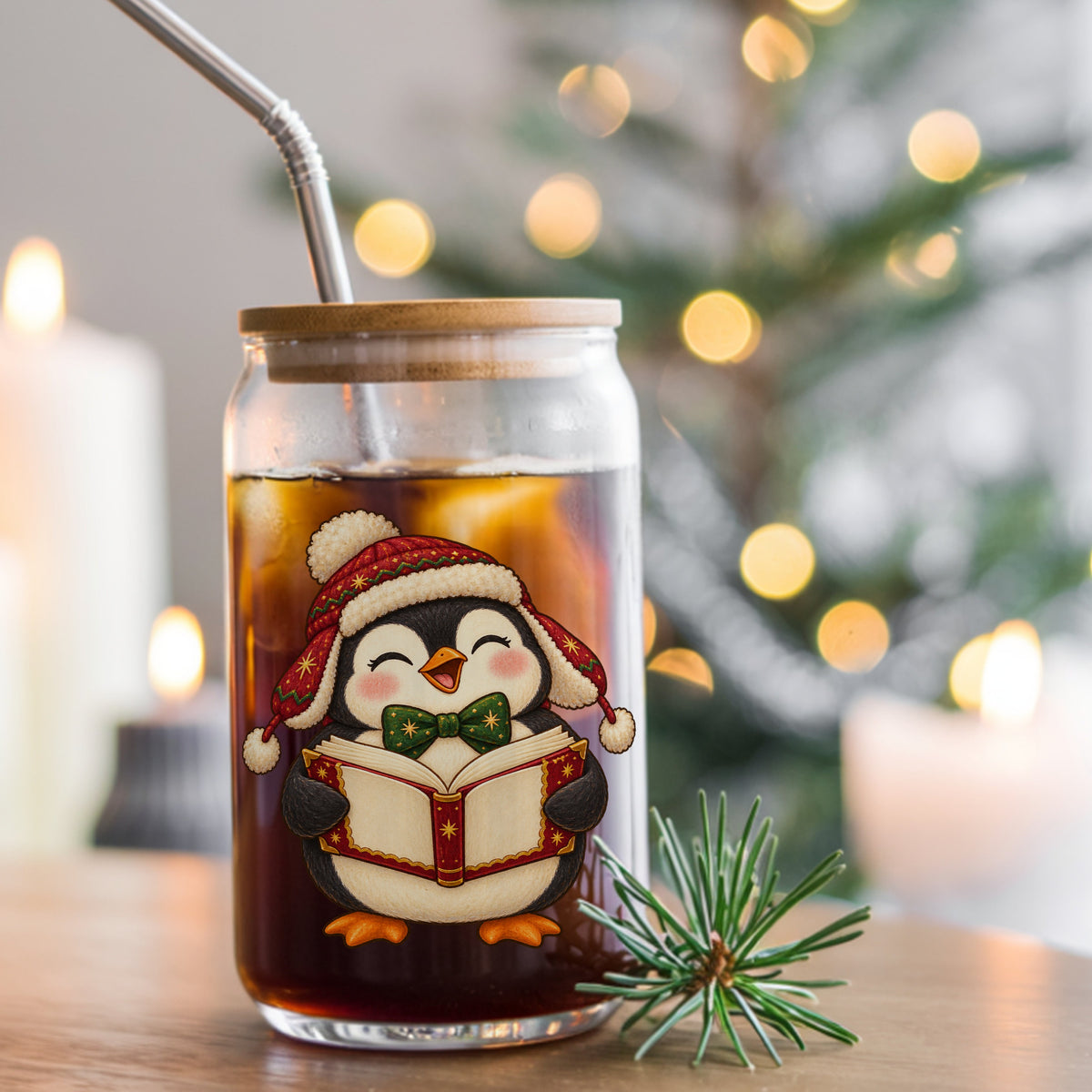 Caroling Penguin With Carol Book UV DTF sticker applied to a glass can cup of iced coffee with a straw