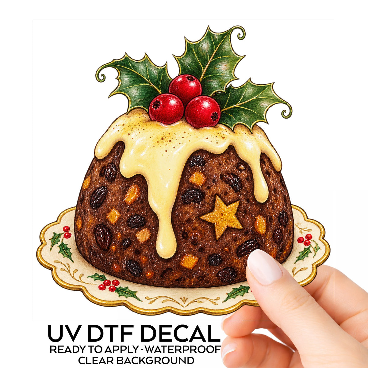 Christmas Pudding With Holly UV DTF sticker on its backing card, held in hand