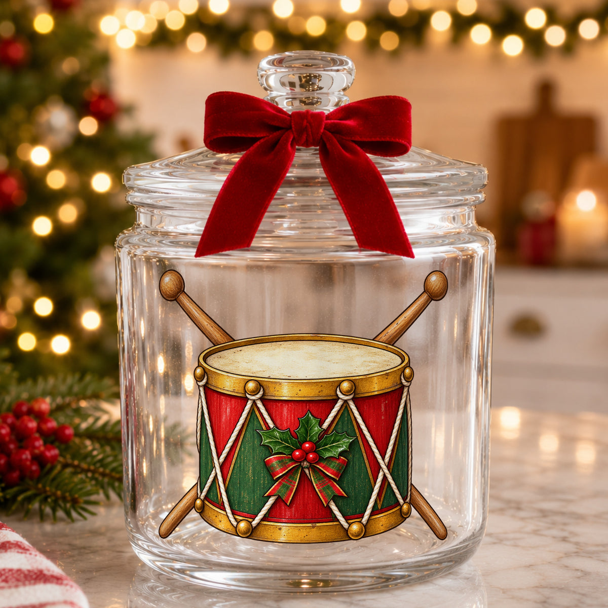 Vintage Toy Drum With Drumsticks UV DTF sticker applied to a glass candy jar tied with a red bow